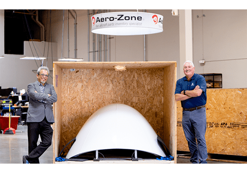 Founder of Aero-Zone  Alfredo Dreyfus and BOK advisor, Mike Carney with front of airplane part.